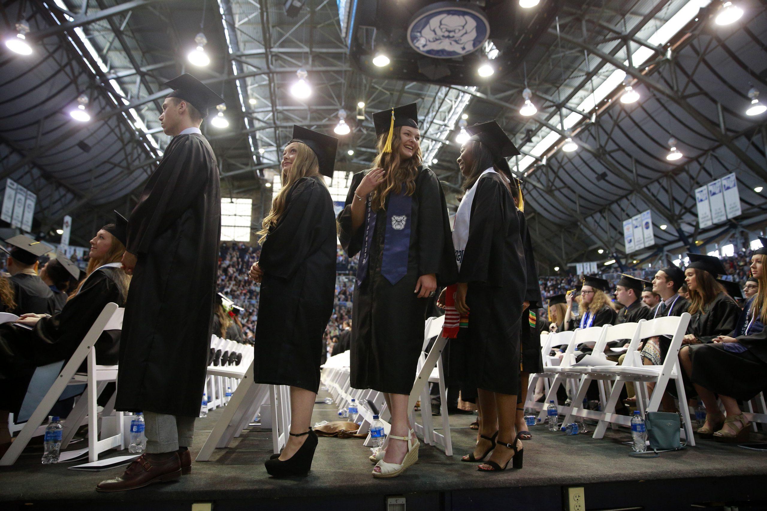 students walking the stage at graduation